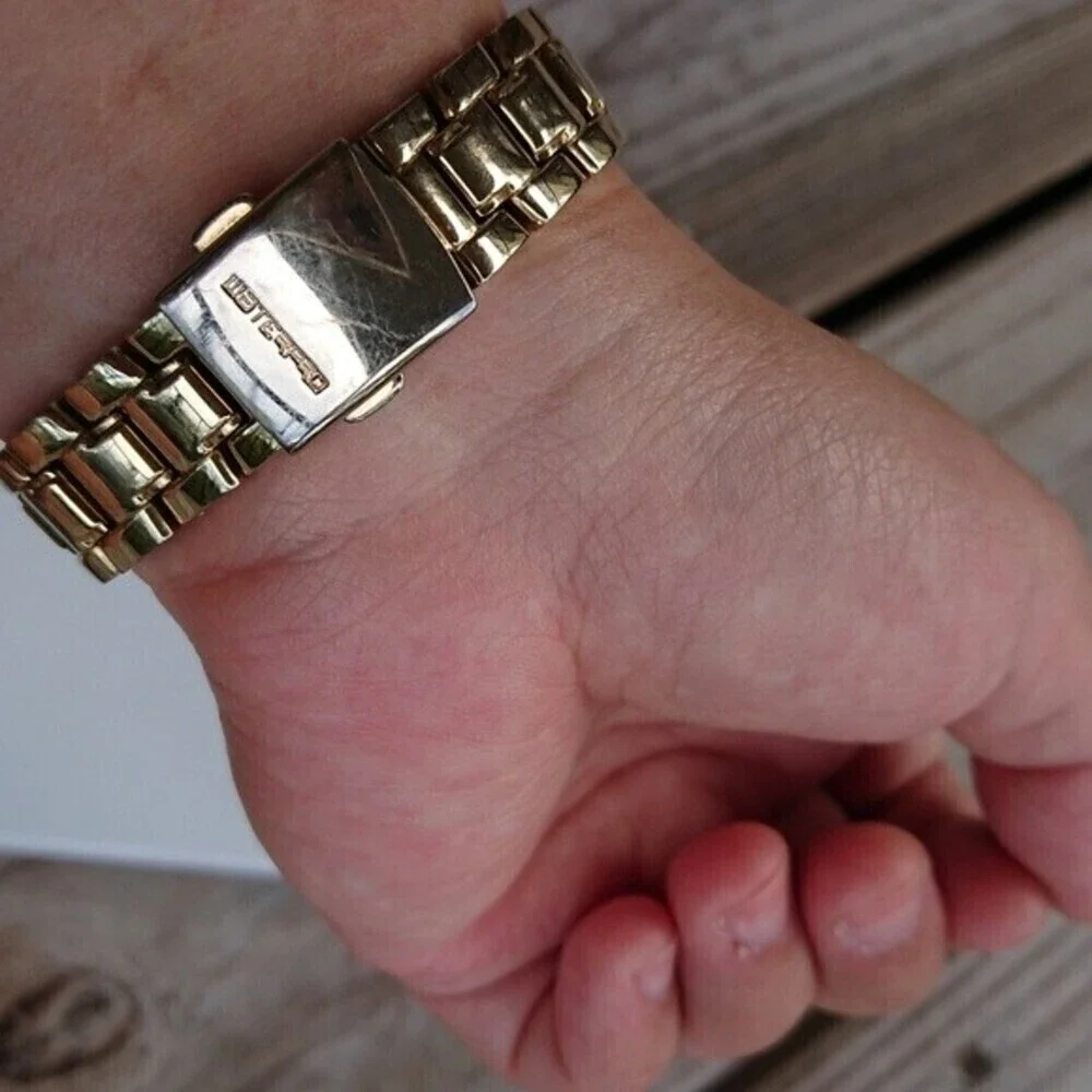 Guess Analog gold tone with rhinestones Watch